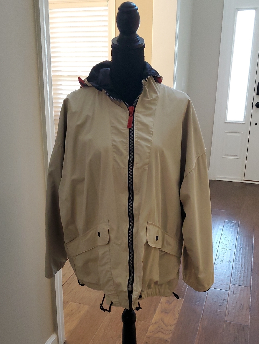 Totes Ladies Beige Hooded Raincoat with Black Lining.